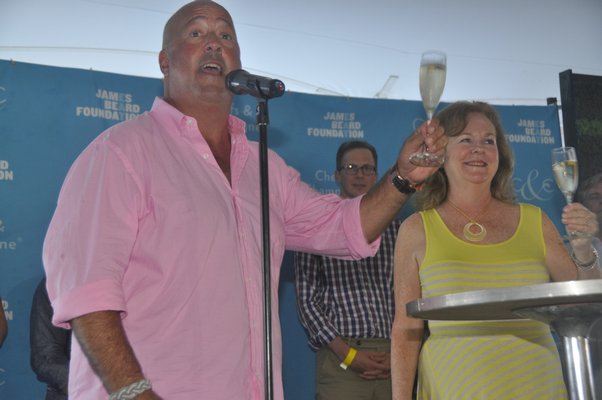 Andrew Zimmern and Susan Ungaro raise their glasses. MICHELLE TRAURING