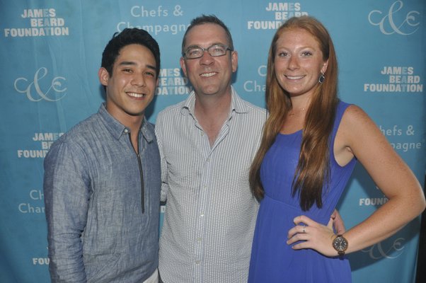 James Beard Foundation Scholarship recipients Jhonel Faelnar, left, and Christina Cassel, right, with Ted Allen. MICHELLE TRAURING