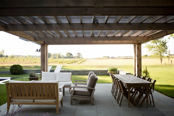 Bill D’Agata and Bill Hall were asked to create a “disappearing fence” outside a custom pool, patio and pergola overlooking a farm and were able to preserve "a clear and special vantage point."