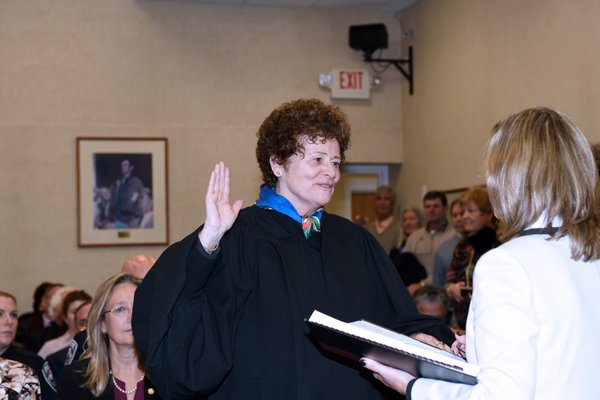 Judge Deborah Kooperstein is sworn in.