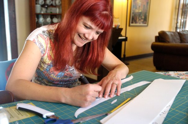 Katrina Lovett working on a foam blade for her Comic Con character, Tauriel, an elf from the Hobbit. DANA SHAW