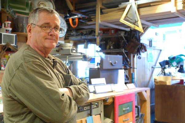 Larry O'Toole in his shop in Hampton Bays.  DANA SHAW