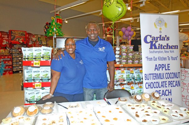 Carla James and Antonio during the "roll out" of her pies at the Riverhead Stop and Shop on Friday afternoon. DANA SHAW