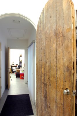 A door made from an old water tower from Jaramillo and  LaRue Johnson's old building in New York City.