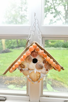 Barbara Stype's shell festooned birdhouse.      DANA SHAW