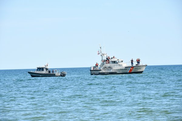 The bay constable and the Coast Guard resopnd to a whale entagled in a net off Town Line Road in Sagaponack.  DANA SHAW