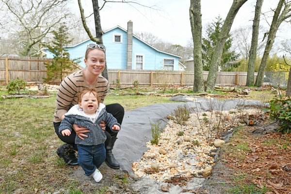 Stephanie and Lochan Miller with the rain garden.  DANA SHAW