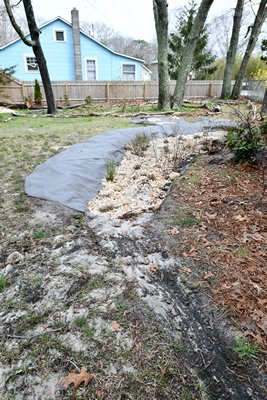 The rain garden in the Miller's yard in falders is under construction.  DANA SHAW