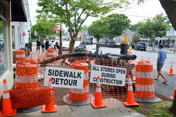 Construction in the alleyway closed a portion of the sidewalk between 103 and 105 Main Street in Westhampton Beach. ANISAH ABDULLAH