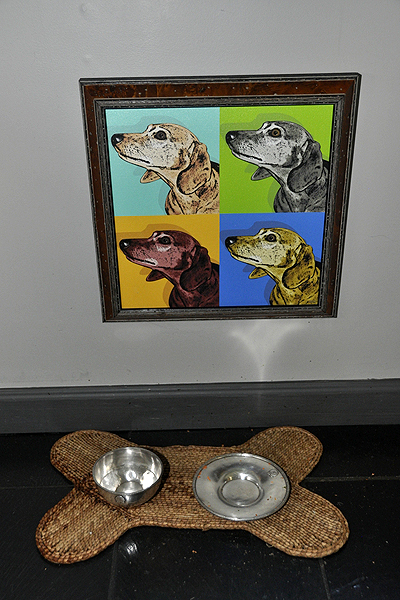 Basil's "Warhol" hangs by her dishes in the kitchen. MICHELLE TRAURING