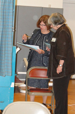 Southampton School District Clerk Mary Pontieri helps count booth votes.<br>Photo by Colleen Reynolds