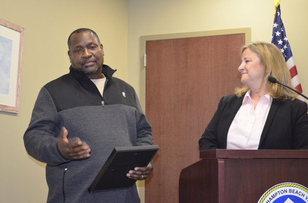 Westhampton Beach DPW Labor Crew Leader Greg Liggon receiving a proclamation for his retirement from Mayor Maria Moore on behalf of the village. ANISAH ABDULLAH