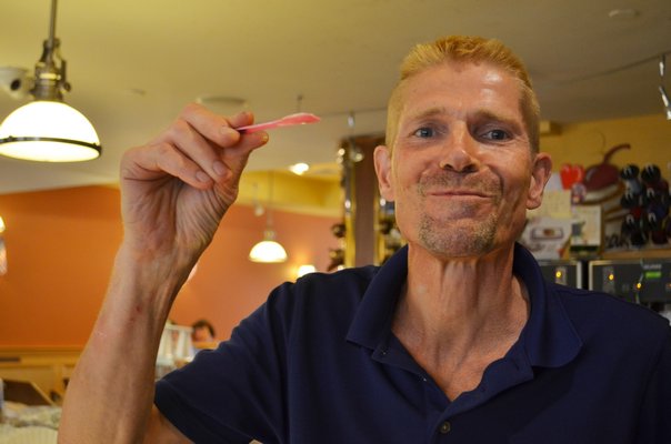 Simon Jorna sampling a flavor of gelato. ANISAH ABDULLAH