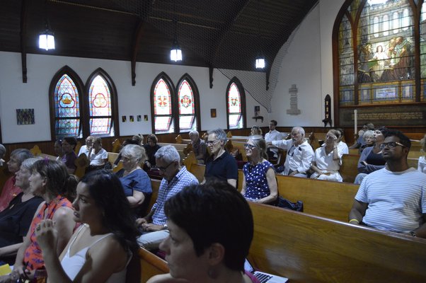 Minerva Perez, executive director of OLA, addresses the volunteers at Christ Episcopal Church in Sag Harbor on July 3.