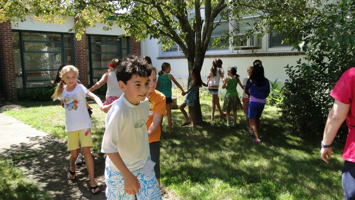 Camp Invention students participate in a team-building exercise in the Springs School courtyard. COLLEEN REYNOLDS