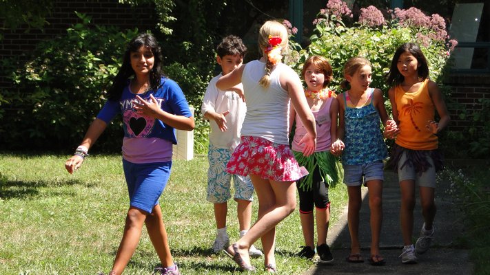 Camp Invention students participate in a team-building exercise in the Springs School courtyard. COLLEEN REYNOLDS