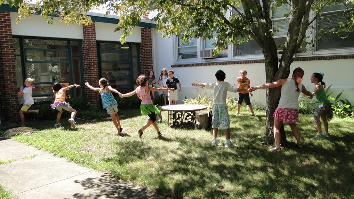 Camp Invention students participate in a team-building exercise in the Springs School courtyard. COLLEEN REYNOLDS