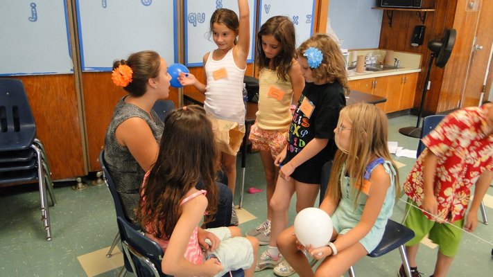 Camp Invention students at Springs School use balloons as part of an exercise in air pressu