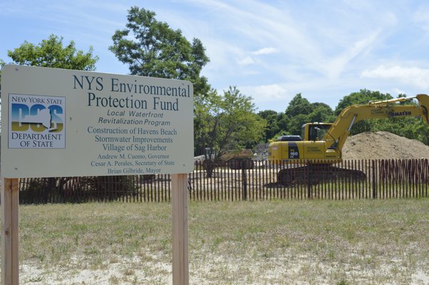The remediation project at Havens Beach, which will attempt eliminate the stormwater runoff problem that has plagued the bathing beach for years, is in its final stages, with the ditch fully drained and native vegetation to be planted in the coming days. BRANDON B. QUINN PHOTOS