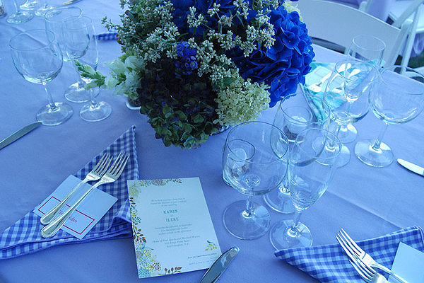 The table settings and wedding invitation.   BARBARA GAINES