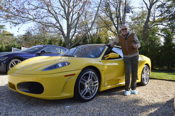 November 11 --  Licensed real estate salesperson Noel Love with a 2007 Ferrari F430 Spider, valued at $150,000. It’s not every day you can test drive a Maserati. But those who stopped by the 2014 Hampton Designer Showhouse on Friday got to do just that. Two Maseratis and a Ferrari sat parked in the pebble-infused driveway of the nearly 12,000-square-foot mansion on Paul’s Lane in Bridgehampton that afternoon, patiently awaiting drivers to plop into their leather seats for a spin. Vincent Horcasitas, one of the real estate agents from Saunders, said the brokerage decided to add the quirky attraction this year to get more potential buyers interested in seeing the residence. “[We] just wanted to try to have an attraction for the house,” Mr. Horcasitas said. “It’s kind of a classy car.”