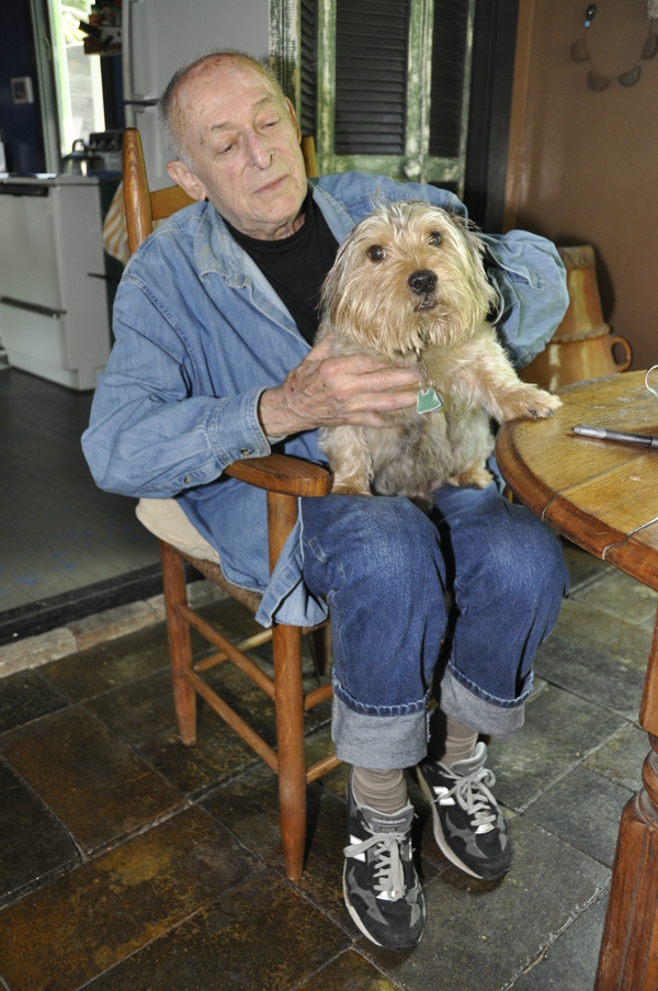 Artist Robert Dash pets Barnsley, his Norwich terrier, at his home and garden, Madoo, in Sagaponack.