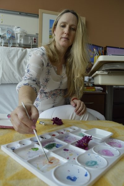 Springs artist Kristen Somody Whalen painted while on bed rest at Stony Brook University Hospital before giving birth to her first child, son Stetson Jax, on May 29. She revived a series she had previously created, called "Flowers With Legs," where women with pregnant bellies do fun activities, except their heads are replaced with real flowers. ALYSSA MELILLO