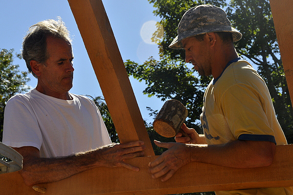 Jon Pines and Jay Comella install the roof. MICHELLE TRAURING