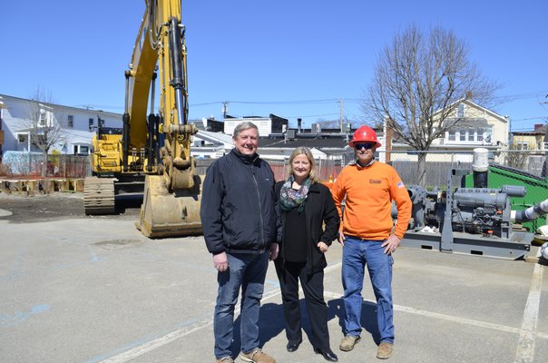 Westhampton Beach Deputy Mayor Ralph Urban, Mayor Maria Moore and Excav Services, Inc. Owner Robert Governale at the construction site for the  drainage system improvements, the first phase of the Main Street reconstruction project. ANISAH ABDULLAH