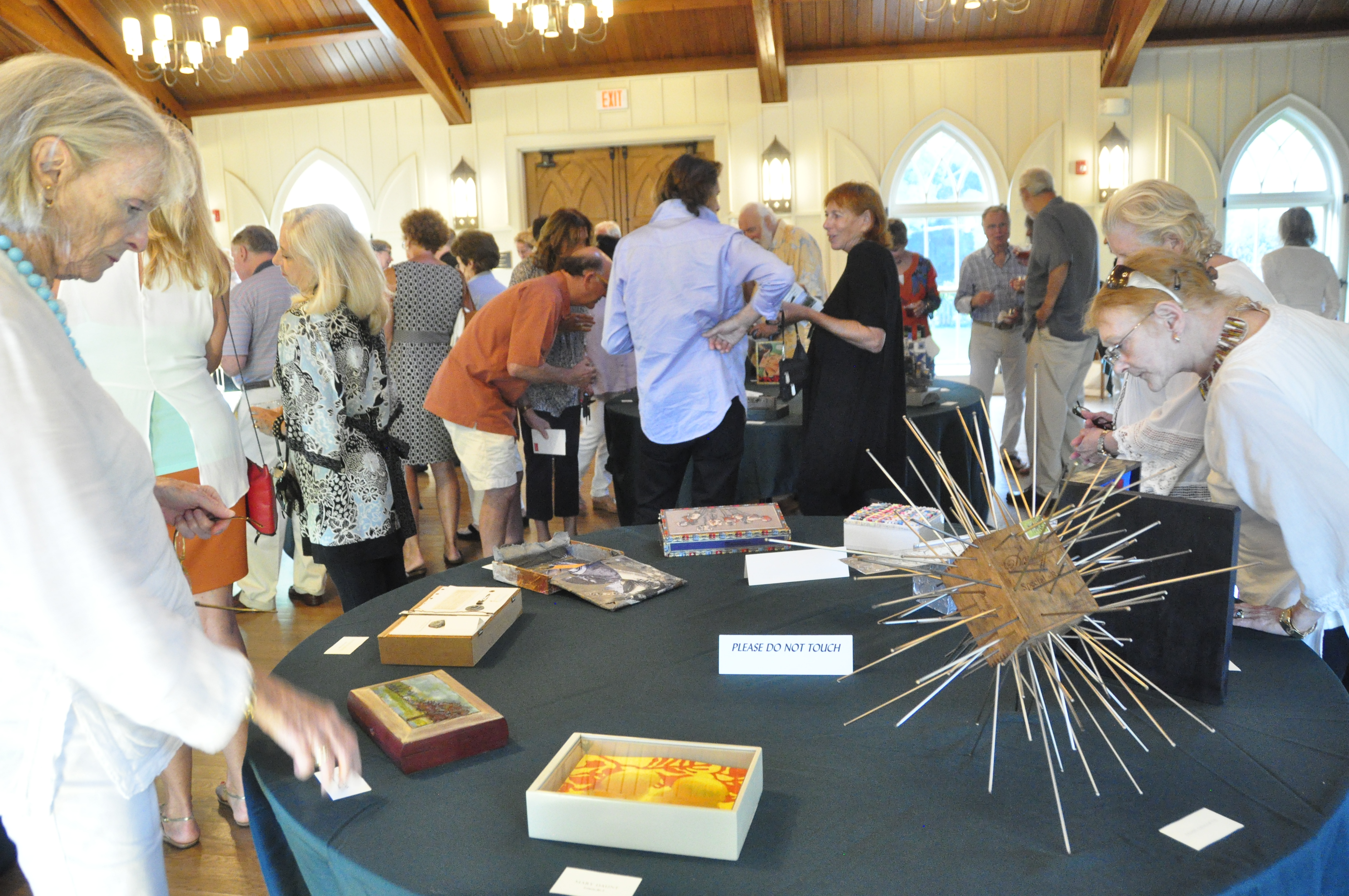 Scenes from the Box Art Auction preview at St. Luke's Church in East Hampton. MICHELLE TRAURING
