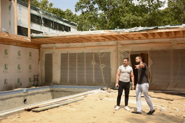 Assaf Leib and Italian architect Federico Maio examining the progress made at the Goodwood Road job site in July. JD ALLEN