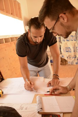 Assaf Leib and Italian architect Federico Maio examining the progress made at the Goodwood Road job site in July. JD ALLEN