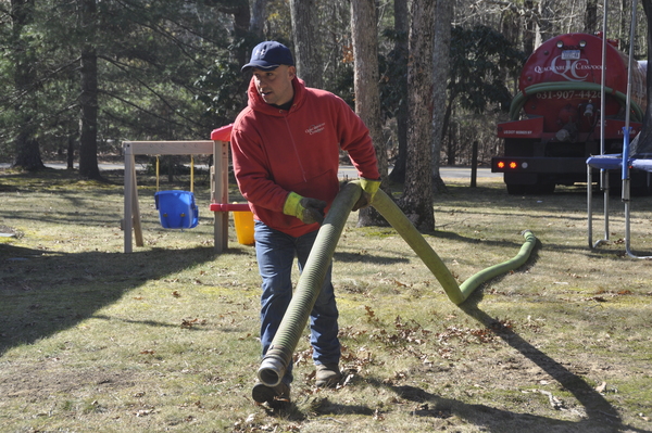 James Quackenbush, co-owner of Quackenbush Cesspools in East Hampton, gets ready to pump a cesspool.