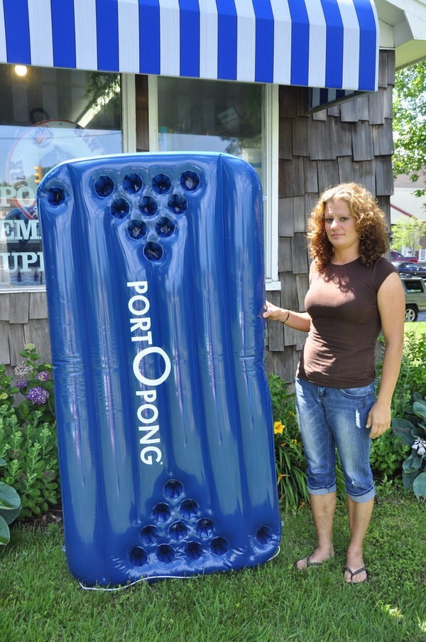 Spring & Summer Activities service manager Loretta Stephens sells PortOPong at the Hampton Bays store.