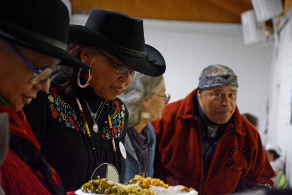 Robin Weeks, Shane's father, and the rest of the elders get first dibs at the feast prepared for
