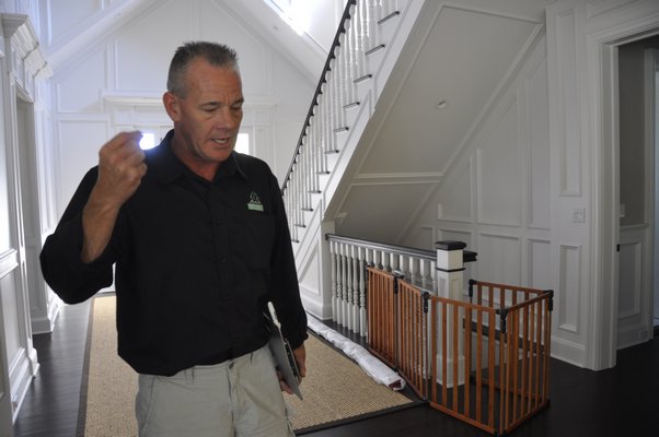 Chris Capalbo inspects a home in Sag Harbor. MICHELLE TRAURING