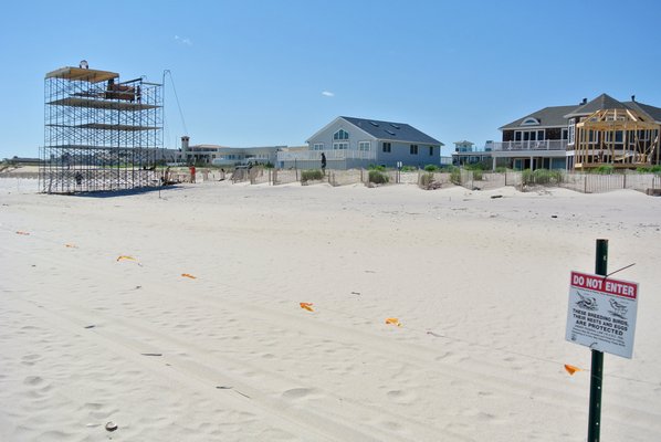 A scaffold for the film "The Other Woman has gone up on the beach in East Quogue between two nesting areas. DANA SHAW