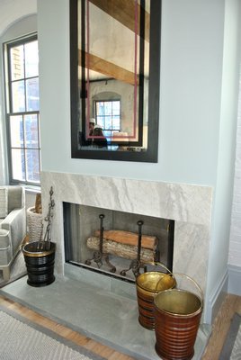 A wood burning fireplace in the living area in one of the Watchcase Factory loft penthouses. DANA SHAW