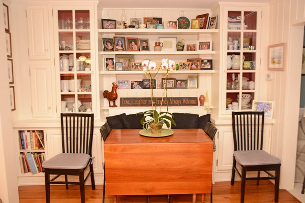 A wall unit houses recent family photos and memories. JD ALLEN