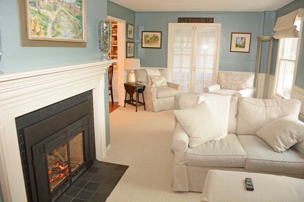 A roaring fire burns in the gas fireplace in the living room. The room offers several nooks and crannies. JD ALLEN