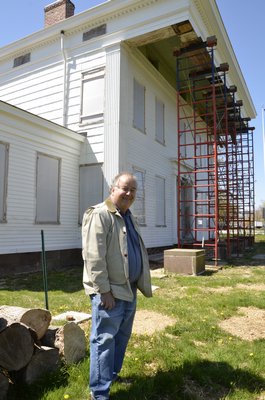 Bridgehampton Historical Society Executive Director John Eilertsen stands in front of the Nathaniel Rogers House in Bridgehampton. By Shaye Weaver
