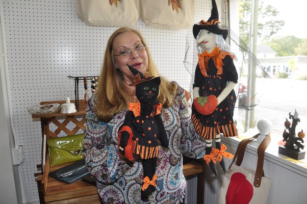 Charlene Maloney displays Halloween goodies at her store, Calico Garden in East Quogue. MICHELLE TRAURING