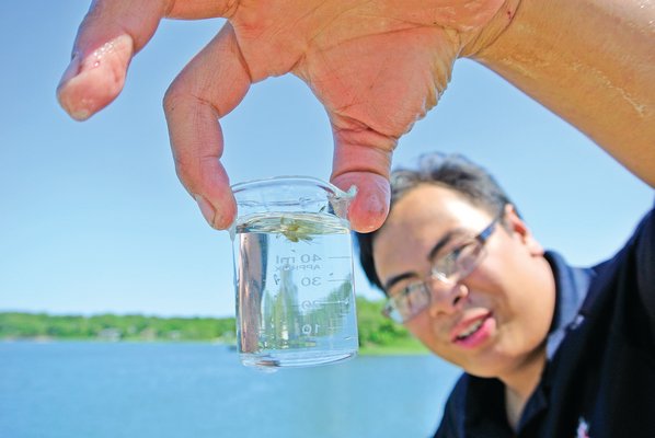June 20: The Sea Scouts hosted an open house on Saturday to show the progress on the hatchery being constructed at Conscience Point. Hatchery manager Aaron Cuisson displays a jar of krill.