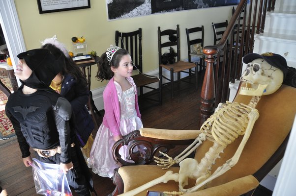 A skeleton greets trick-or-treaters. MICHELLE TRAURING