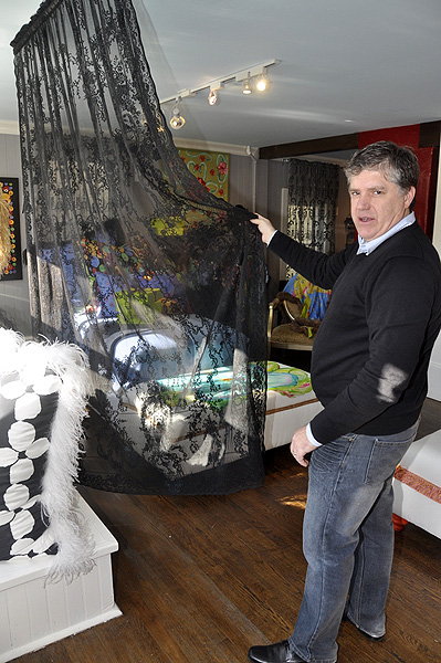 Prince of Scots President Tim Danser holds up The Kate, a style of lace window treatments from MYB Textiles that decorate Madonna's home in Manhattan. MICHELLE TRAURING