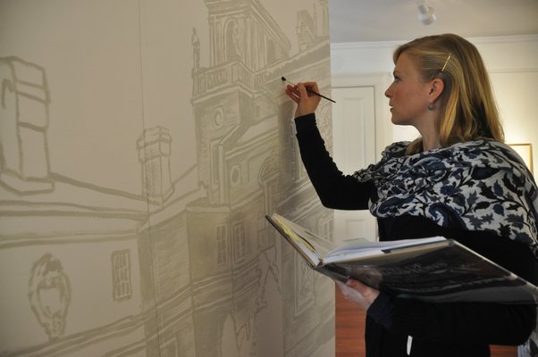 Emma Ballou is painting a mural of a castle-like Southampton summer estate, Ville Mille Fiori. MICHELLE TRAURING