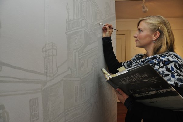 Emma Ballou is painting a mural of a castle-like Southampton summer estate, Ville Mille Fiori. MICHELLE TRAURING