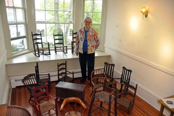 Gerri MacWhinnie and a collection of antique chairs from her own collection that will be on display at the Southampton Historical Museum. MICHELLE TRAURING