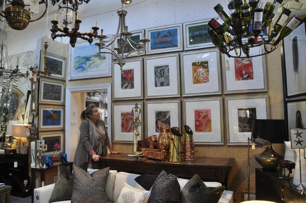 Zoe Hoare, left, and Chris Mead are selling a collection of Chagall prints at English Country Antiques in Bridgehampton. MICHELLE TRAURING