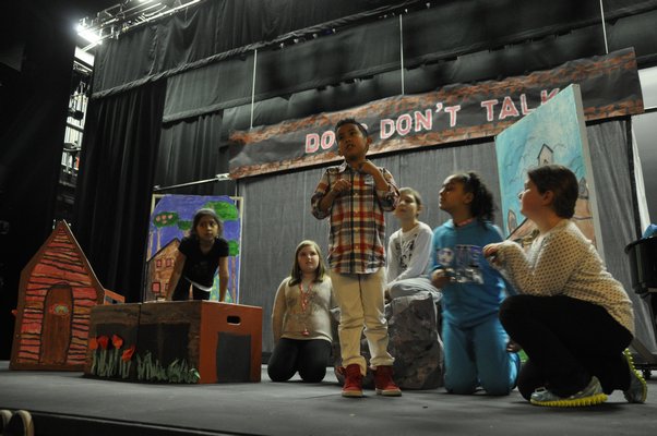The Springs School Opera Company rehearses its original production, "Dogs Don't Talk," at Guild Hall in East Hampton. MICHELLE TRAURING